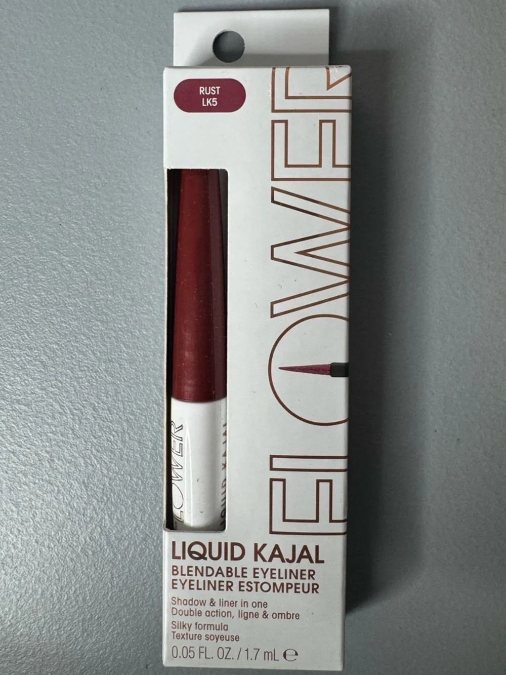 Flower Liquid Kajal Blendable Eyeliner in Rust shadow and eyeliner in one maroon
